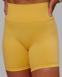 Woman wearing Fusion Ultra High-Rise 6" Short - Banana Cream | Model:Amber | Size:S
