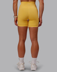Woman wearing Fusion Ultra High-Rise 6" Short - Banana Cream | Model:Amber | Size:S
