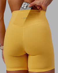 Woman wearing Fusion Ultra High-Rise 6" Short - Banana Cream | Model:Amber | Size:S