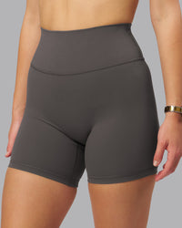 Woman wearing Fusion Ultra High-Rise 6" Short - Dark Storm | Set:true | Angle:closeup | Model:Lillie | Size:S