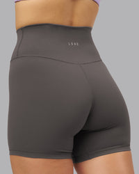 Woman wearing Fusion Ultra High-Rise 6" Short - Dark Storm | Model:Lillie | Size:S