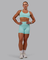 Woman wearing Fusion Ultra High-Rise 6" Short - Island Paradise | Model:Amber | Size:S