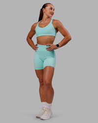 Woman wearing Fusion Ultra High-Rise 6" Short - Island Paradise | Model:Amber | Size:S