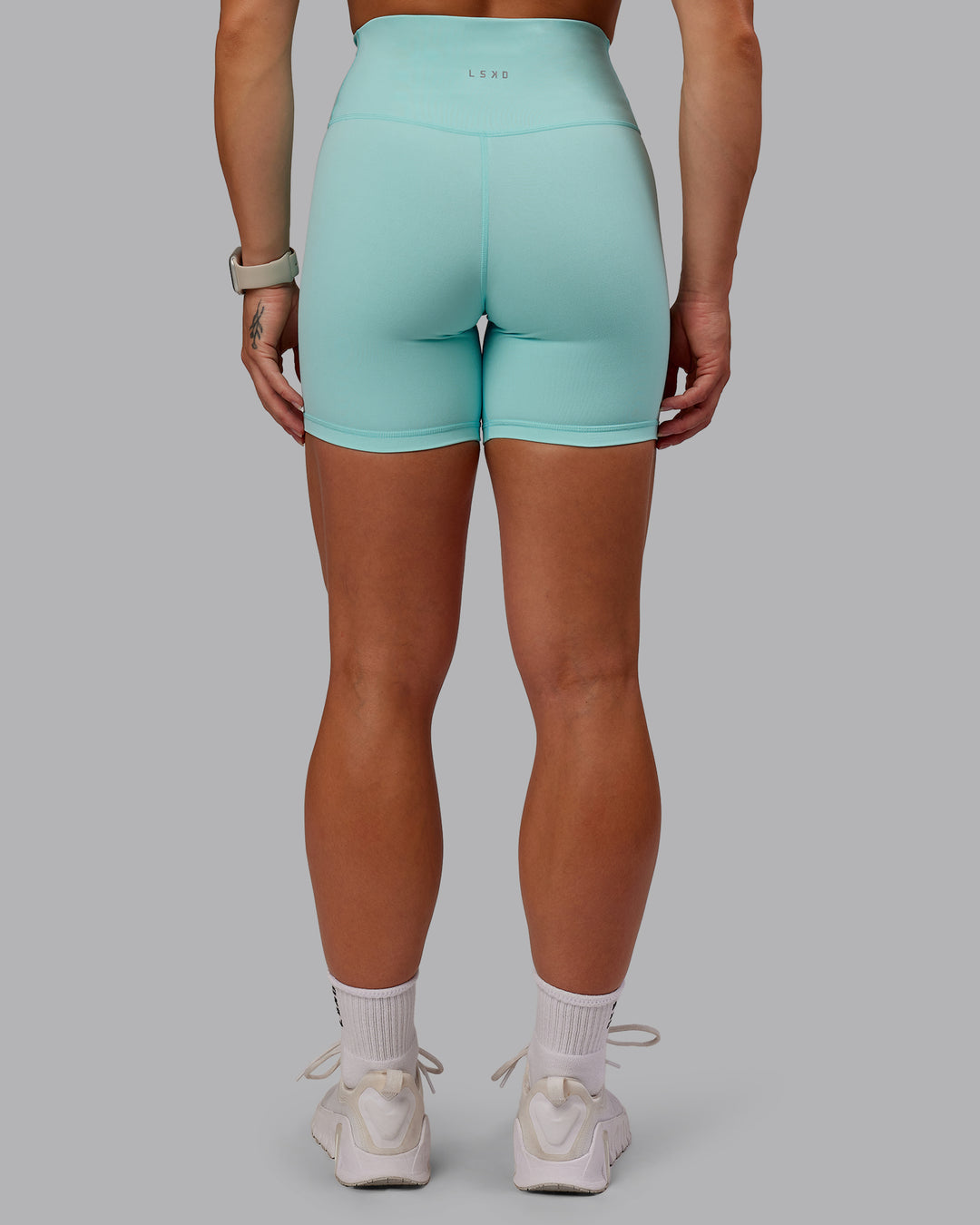 Woman wearing Fusion Ultra High-Rise 6&quot; Short - Island Paradise | Model:Amber | Size:S