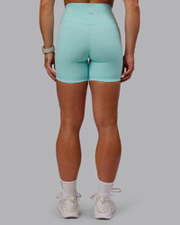 Woman wearing Fusion Ultra High-Rise 6" Short - Island Paradise | Model:Amber | Size:S