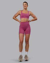 Woman wearing Fusion Ultra High-Rise 6" Short Pockets - Mauve Haze | Model:Chloe | Size:XS