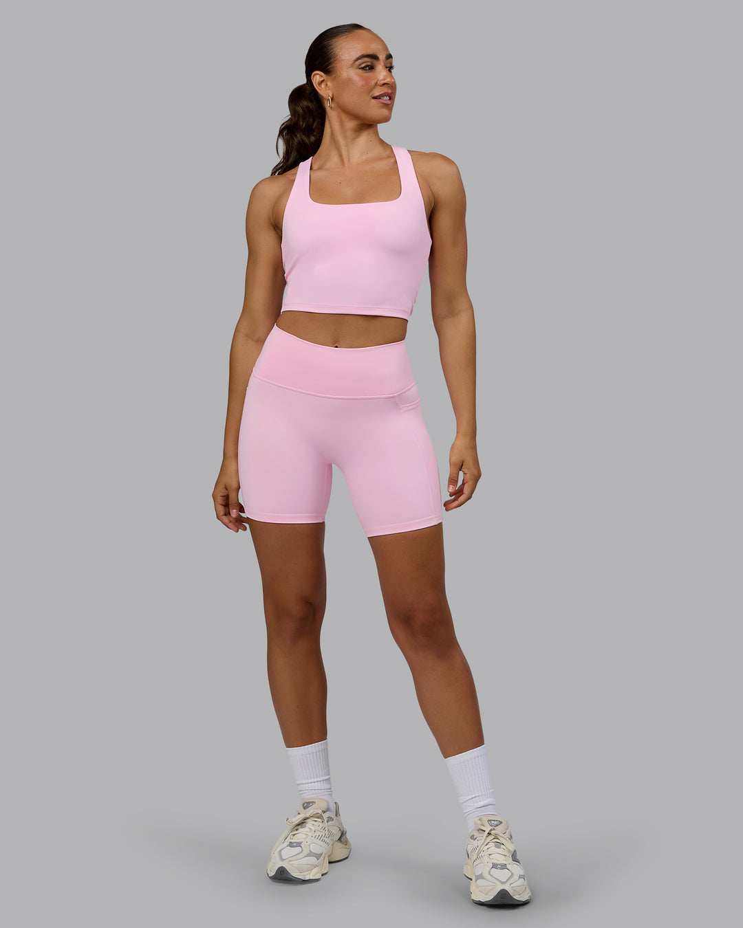 Woman wearing Fusion Ultra High-Rise 6&quot; Short Pockets - Pale Pink | Model:Sophie | Size:S