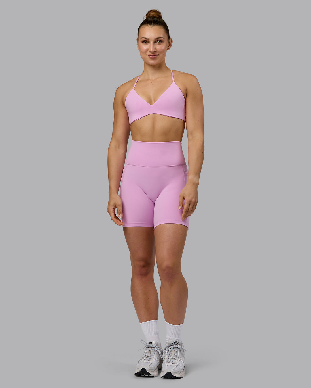 Woman wearing Fusion Ultra High-Rise 6&quot; Short Pockets - Pastel Orchid | Model:Zoe | Size:S