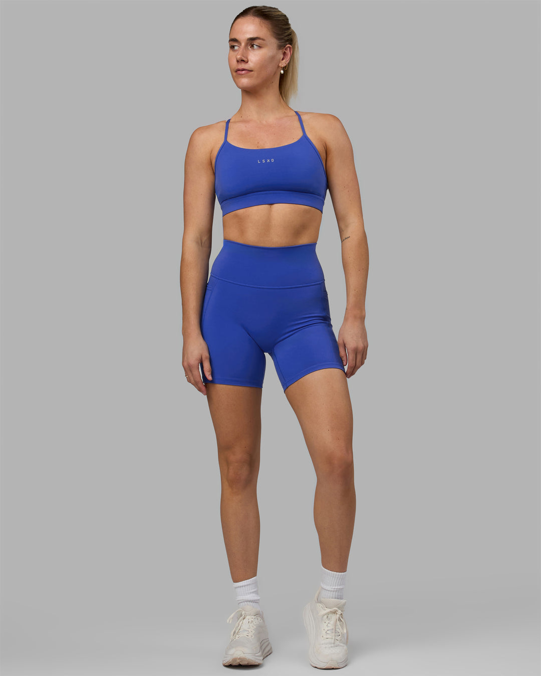 Woman wearing Fusion Ultra High-Rise 6&quot; Short Pockets - Power Cobalt | Model:Hannah | Size:S