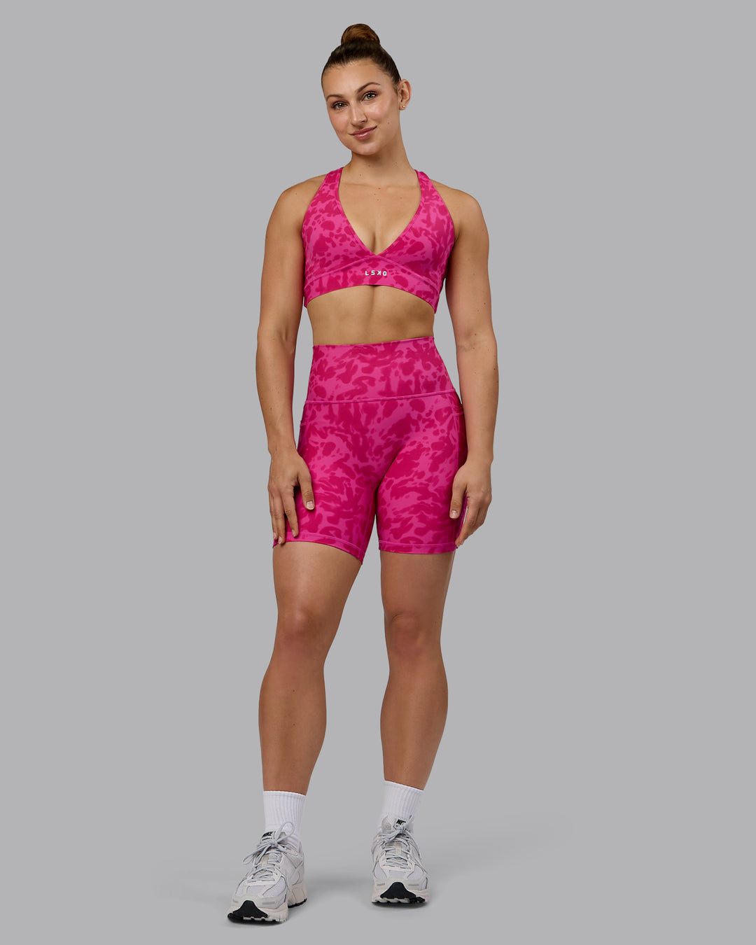 Woman wearing Fusion Ultra High-Rise 6&quot; Short Pockets - Strawberry-Lava Lamp | Model:Zoe | Size:S