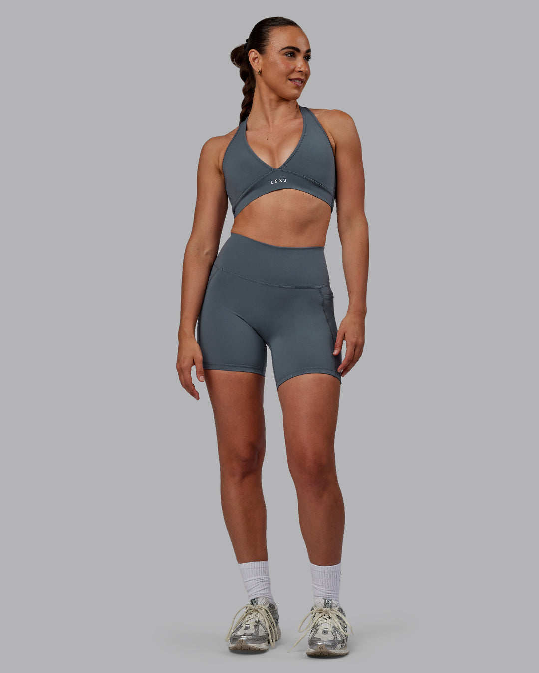 Woman wearing Fusion Ultra High-Rise 6&quot; Short Pockets - Turbulence | Model:Sophie | Size:S