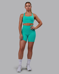 Woman wearing Fusion Ultra High-Rise 6" Short Pockets - Turquoise Tide | Model:Hannah | Size:S