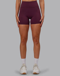 Woman wearing Fusion Ultra High-Rise 6" Short Pockets - Cherry Lacquer | Set:true | Angle:front | Model:Paris | Size:S
