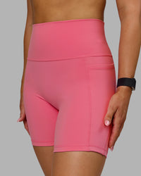 Woman wearing Fusion Ultra High-Rise 6" Short Pockets - Pink Lemonade | Model:Halle | Size:S