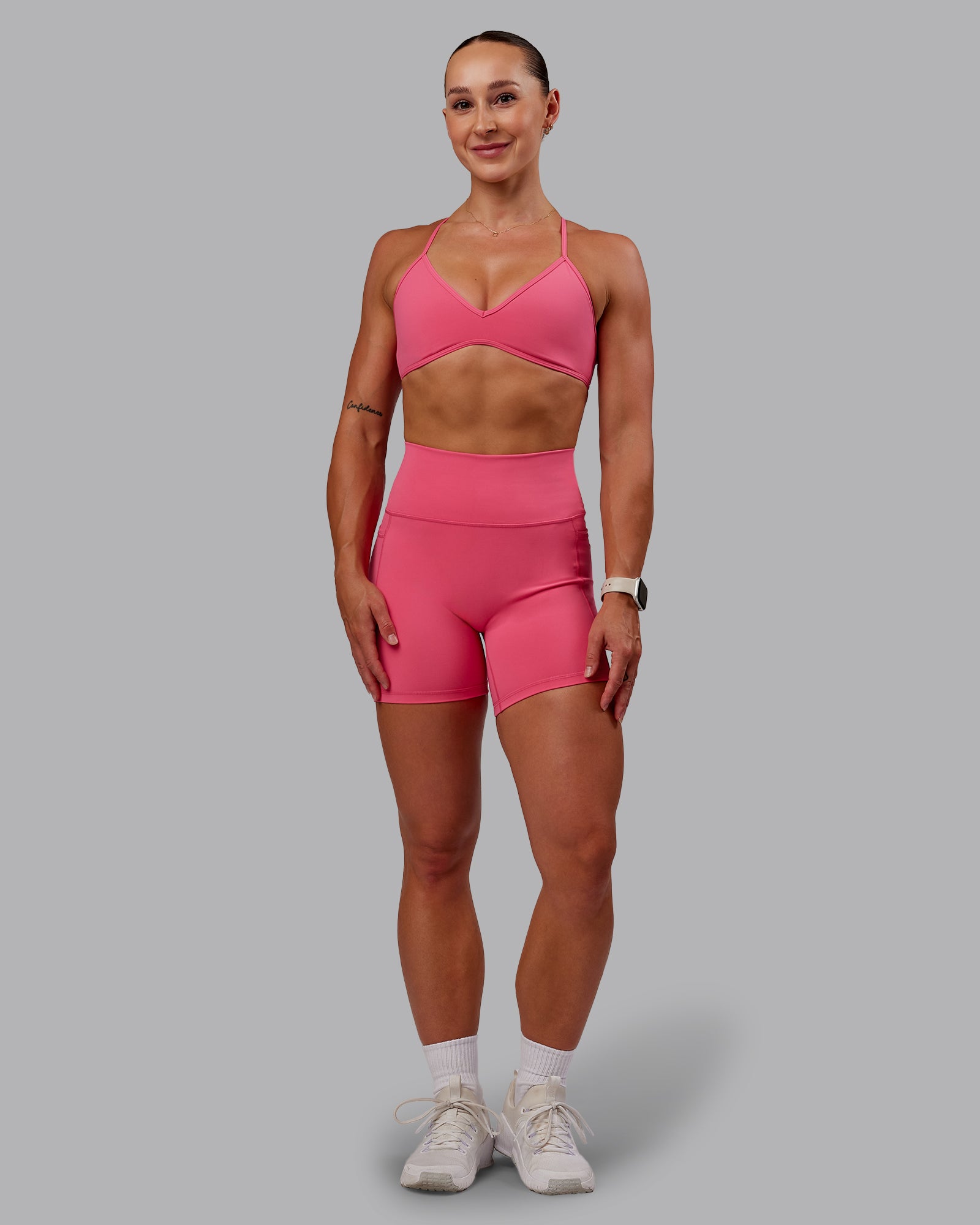Woman wearing Fusion Ultra High-Rise 6" Short Pockets - Hot Pink | Model:Amber | Size:S