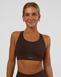 Woman wearing Fusion Sports Bra 2.0 - Hot Chocolate | Model:Amity | Size:S