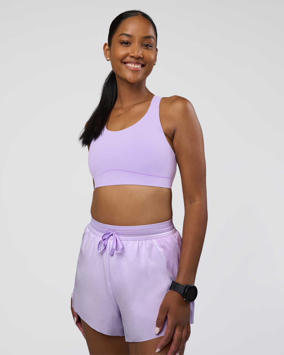 Woman wearing Fusion Sports Bra 2.0 - Pale Lilac | Model:Rica | Size:S