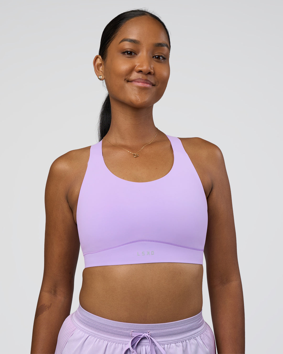 Woman wearing Fusion Sports Bra 2.0 - Pale Lilac | Model:Rica | Size:S