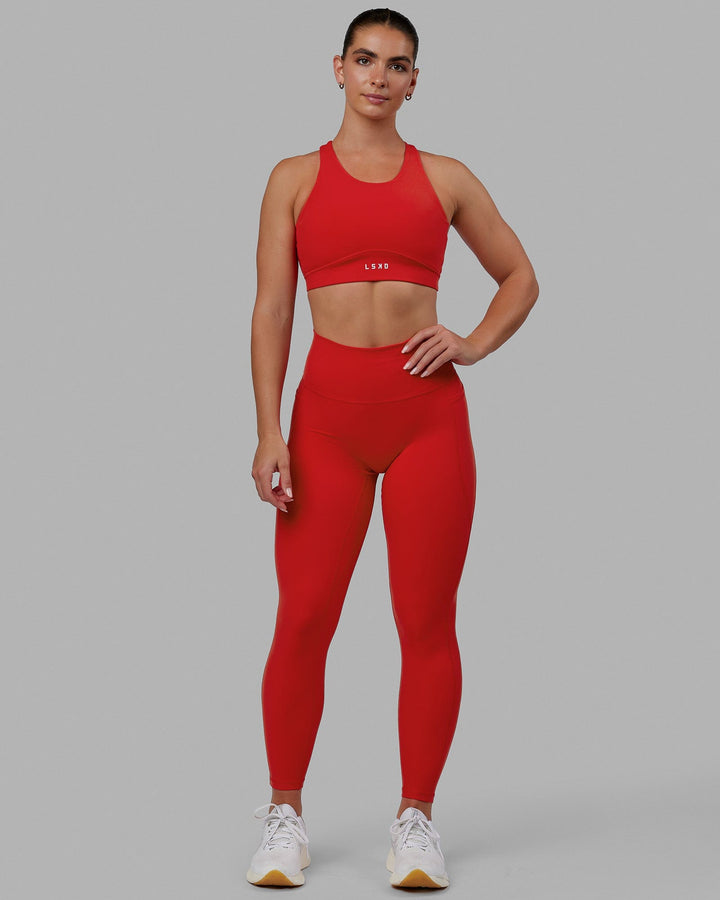 Woman wearing Fusion Sports Bra - Infrared