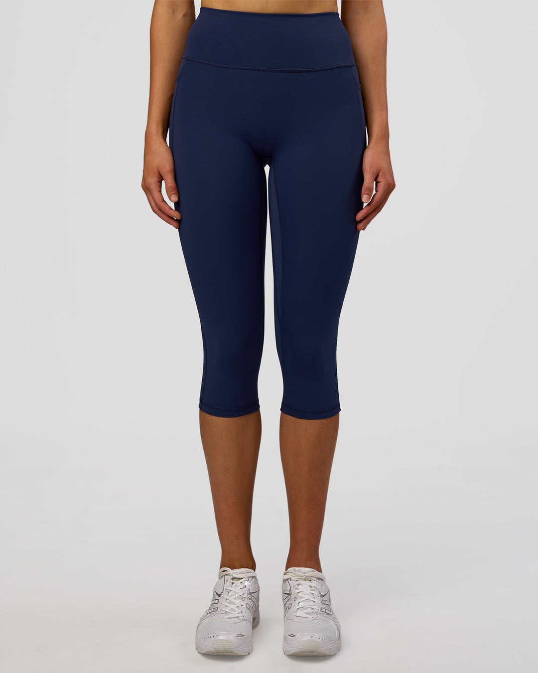 Woman wearing Fusion Ultra High-Rise 3/4 Legging Pockets - Future Navy | Model:Evie | Size:S