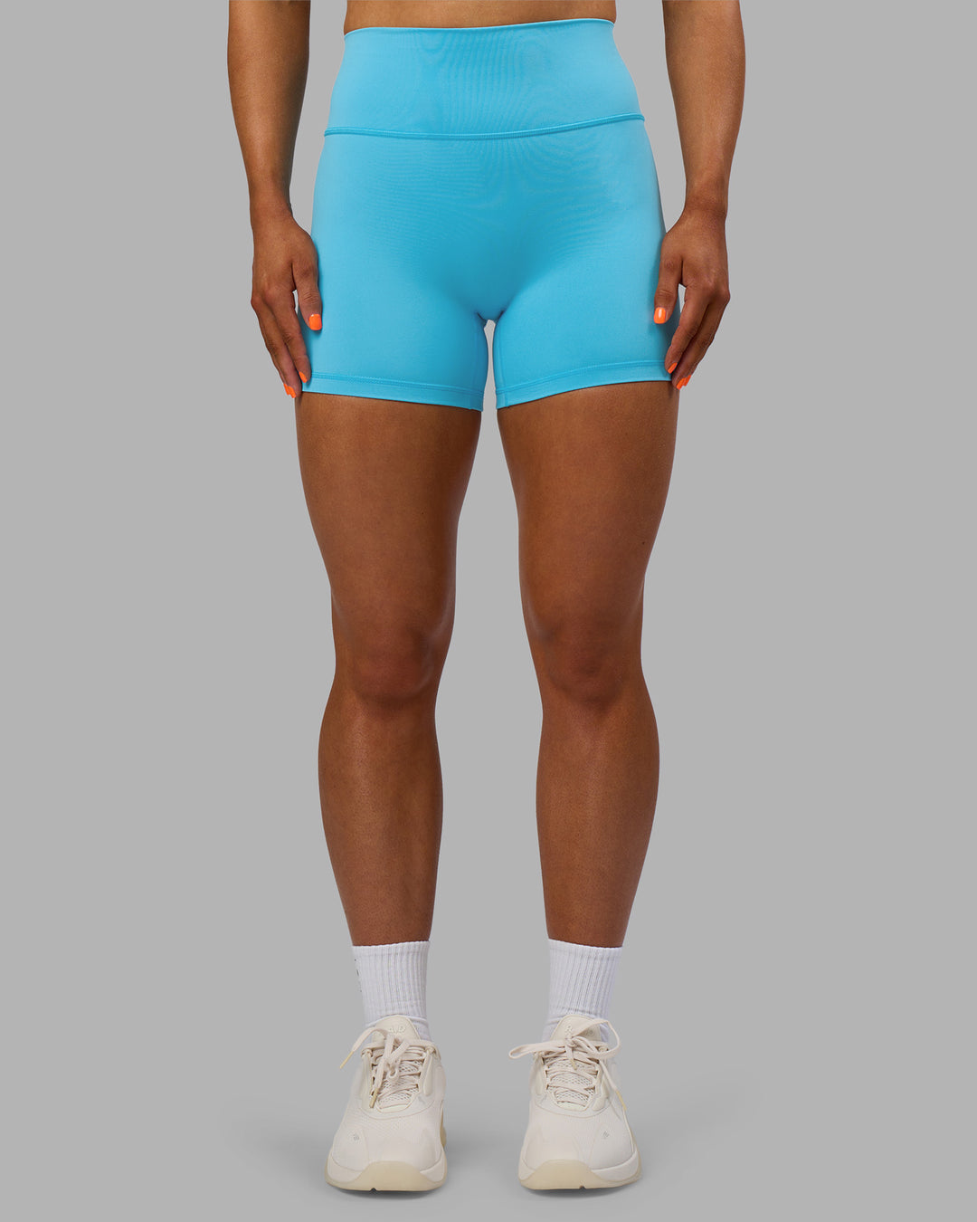 Woman wearing Fusion Ultra High-Rise 4&quot; Short - Blue Atoll | Model:Georgia | Size:S