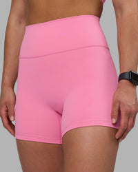 Woman wearing Fusion Ultra High-Rise 4" Short - Candy Pink | Set:true | Angle:closeup | Model:Keisha | Size:S