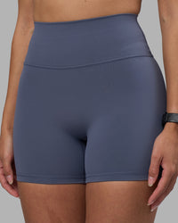 Woman wearing Fusion Ultra High-Rise 4" Short - Night Shadow | Model:Rhiley | Size:S