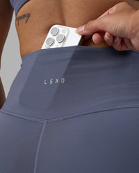 Woman wearing Fusion Ultra High-Rise 4" Short - Night Shadow | Set:true | Angle:closeup | Model:Rhiley | Size:S