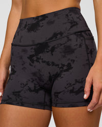 Woman wearing Fusion Ultra High-Rise 4" Short Pockets - Black Tie Dye | Model:Amity | Size:S