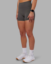 Woman wearing Fusion Ultra High-Rise 4" Short Pockets - Dark Storm | Model:Keisha | Size:S