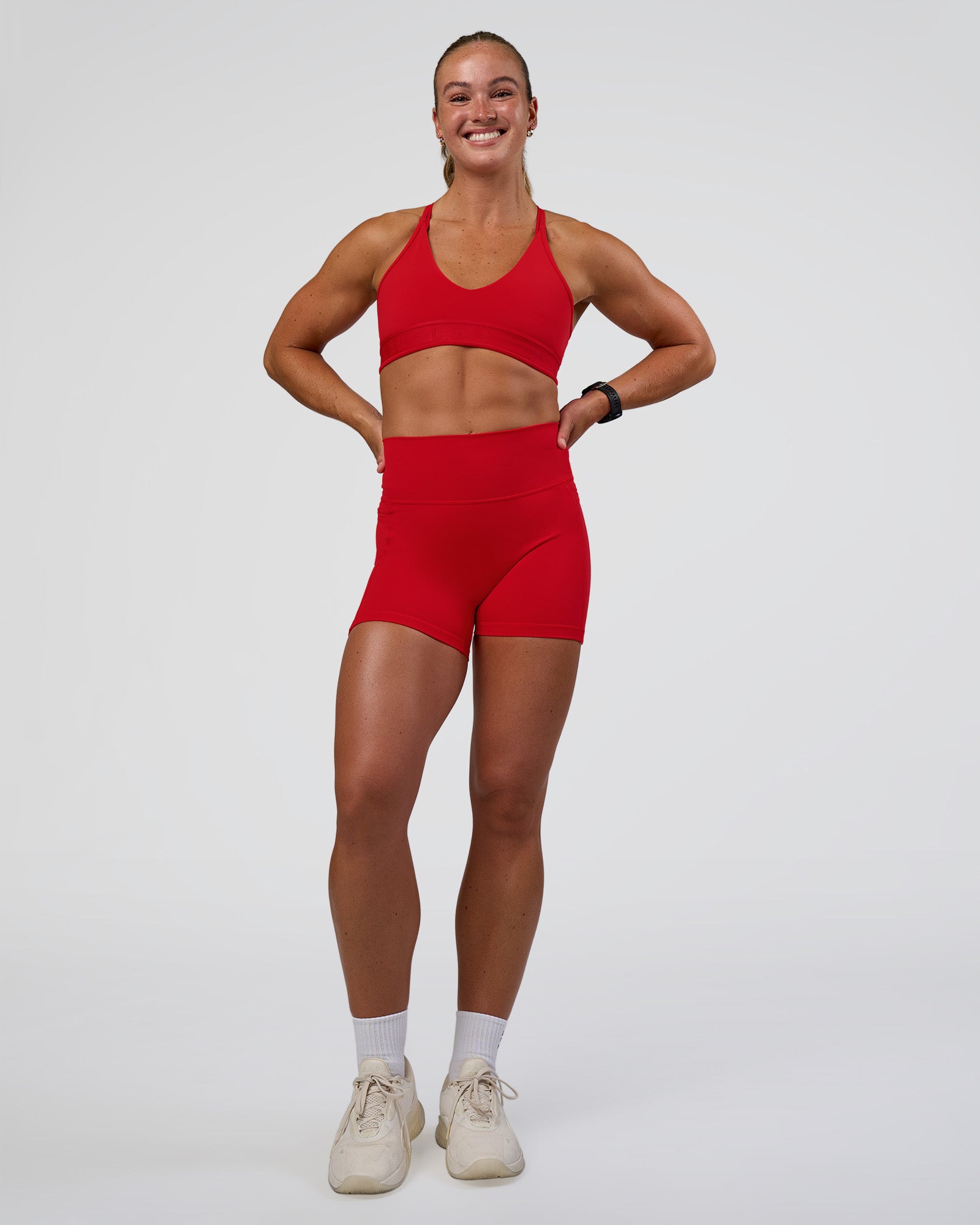 Woman wearing Fusion Ultra High-Rise 4" Short Pockets - Flame | Model:Sav | Size:S