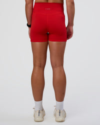 Woman wearing Fusion Ultra High-Rise 4" Short Pockets - Flame | Set:true | Angle:back | Model:Sav | Size:S
