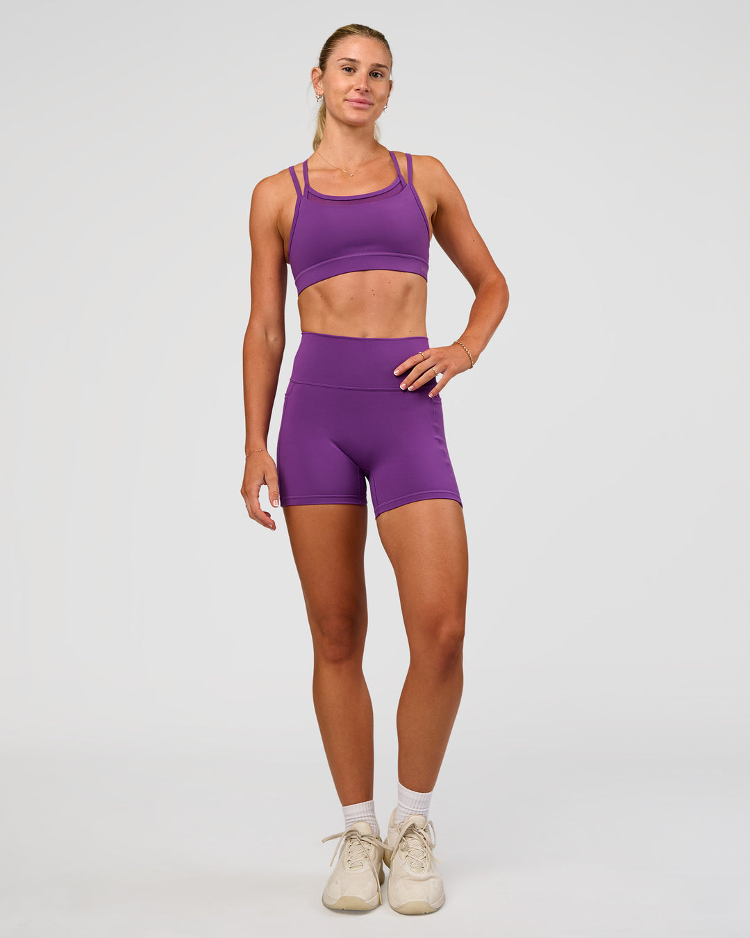 Woman wearing Fusion Ultra High-Rise 4" Short Pockets - Fresh Purple | Model:Emelia | Size:S