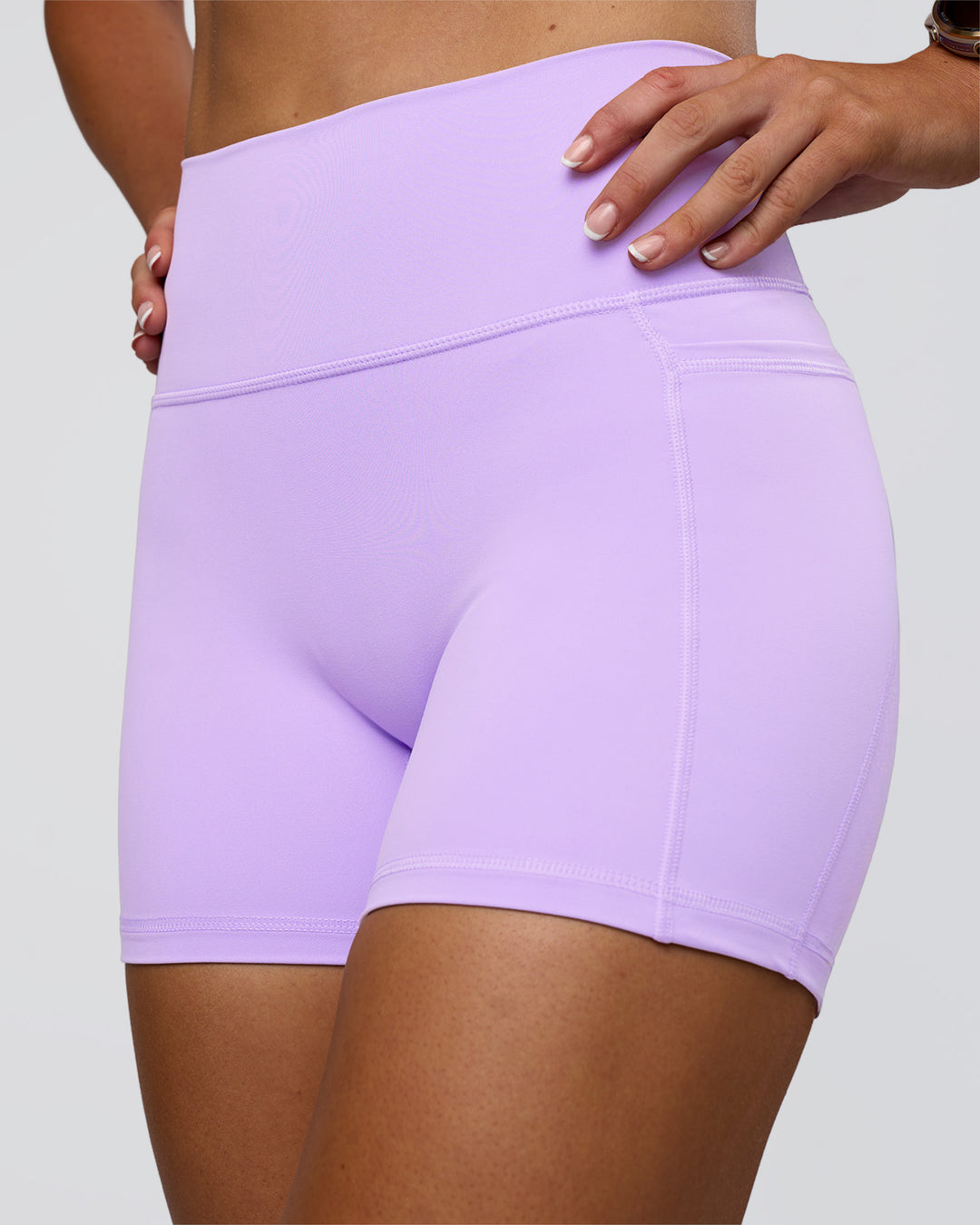 Woman wearing Fusion Ultra High-Rise 4" Short Pockets - Pale Lilac | Model:Emelia | Size:S