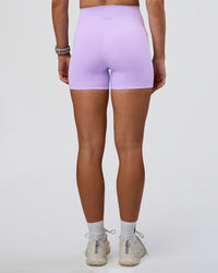 Woman wearing Fusion Ultra High-Rise 4" Short Pockets - Pale Lilac | Model:Emelia | Size:S
