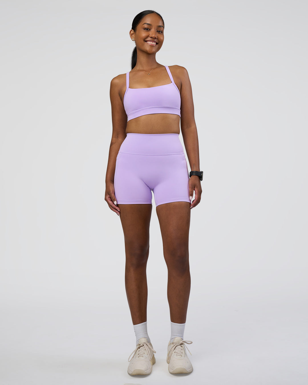 Woman wearing Fusion Ultra High-Rise 4&quot; Short Pockets - Pale Lilac | Model:Rica | Size:S