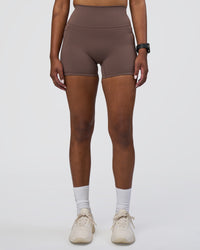 Woman wearing Fusion Ultra High-Rise 4" Short Pockets - Peppercorn | Set:true | Angle:front | Model:Rica | Size:S