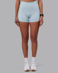 Woman wearing Fusion Ultra High-Rise 4" Short Pockets - Skyride | Model:Rhiley | Size:S