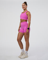 Woman wearing Fusion Ultra High-Rise 4" Short Pockets - Ultra Fuchsia | Model:Abbey | Size:S