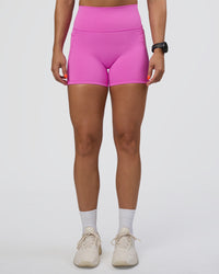 Woman wearing Fusion Ultra High-Rise 4" Short Pockets - Ultra Fuchsia | Set:true | Angle:front | Model:Abbey | Size:S