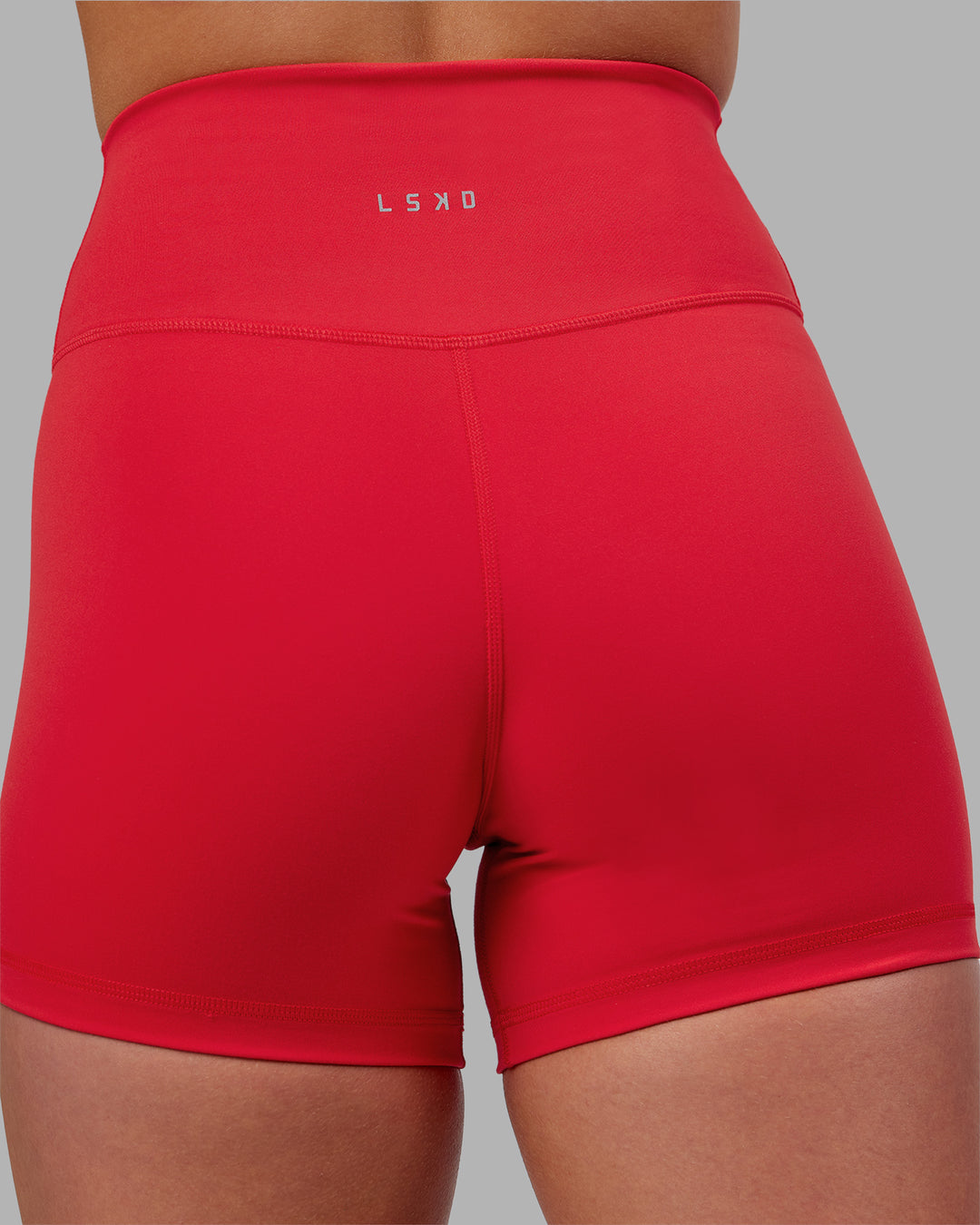 Woman wearing Fusion Ultra High-Rise 4&quot; Short - Scarlet | Model:Keisha | Size:S
