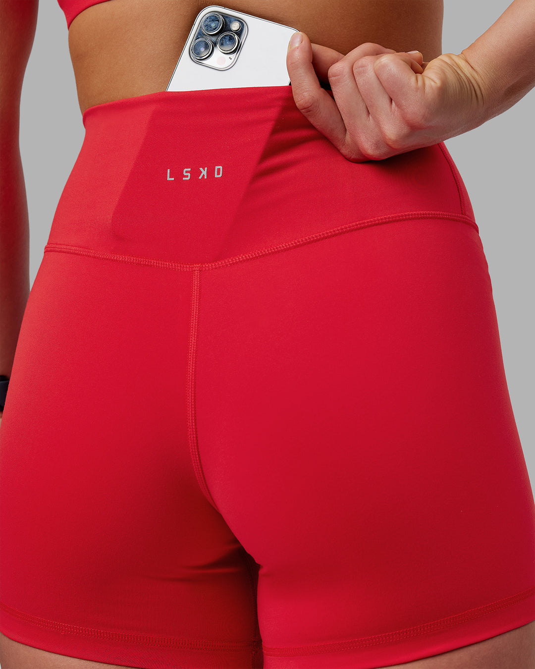 Woman wearing Fusion Ultra High-Rise 4&quot; Short - Scarlet | Model:Keisha | Size:S