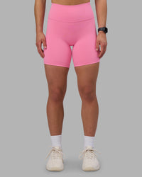 Woman wearing Fusion Ultra High-Rise 6" Short - Candy Pink | Set:true | Angle:front | Model:Keisha | Size:S