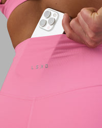 Woman wearing Fusion Ultra High-Rise 6" Short - Candy Pink | Set:true | Angle:closeup | Model:Keisha | Size:S