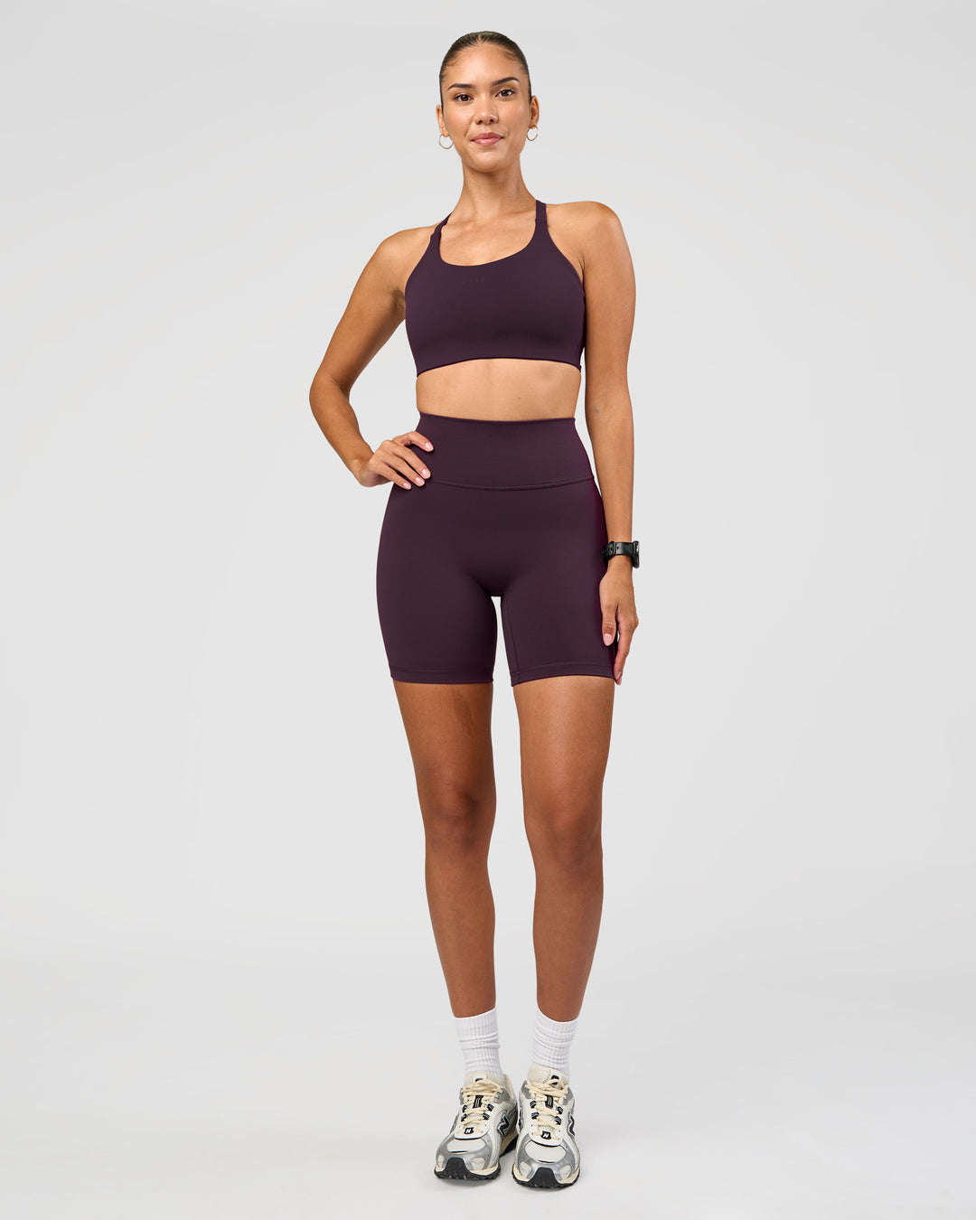 Woman wearing Fusion Ultra High-Rise 6" Short - Midnight Plum | Model:Rhiley | Size:S