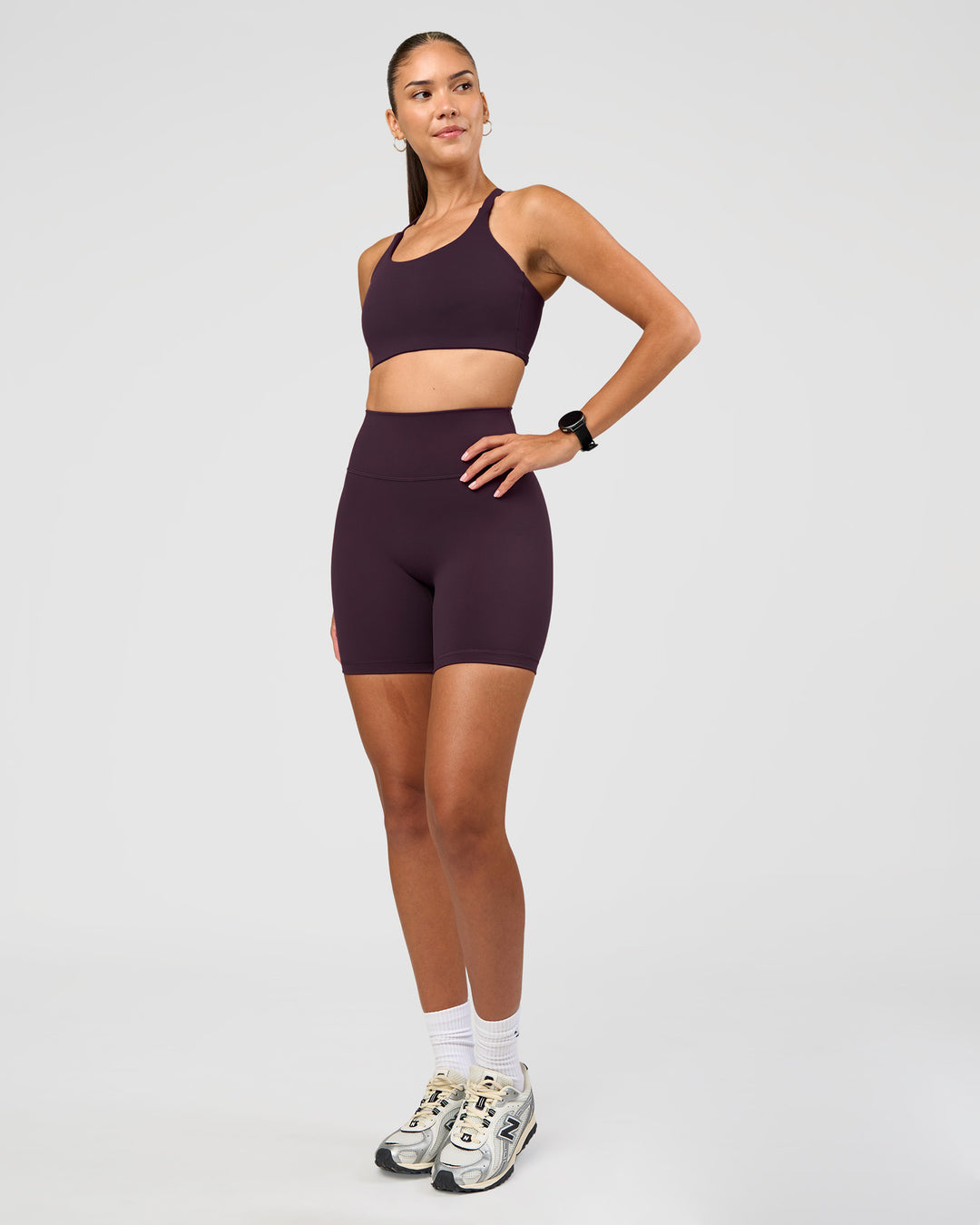 Woman wearing Fusion Ultra High-Rise 6" Short - Midnight Plum | Model:Rhiley | Size:S