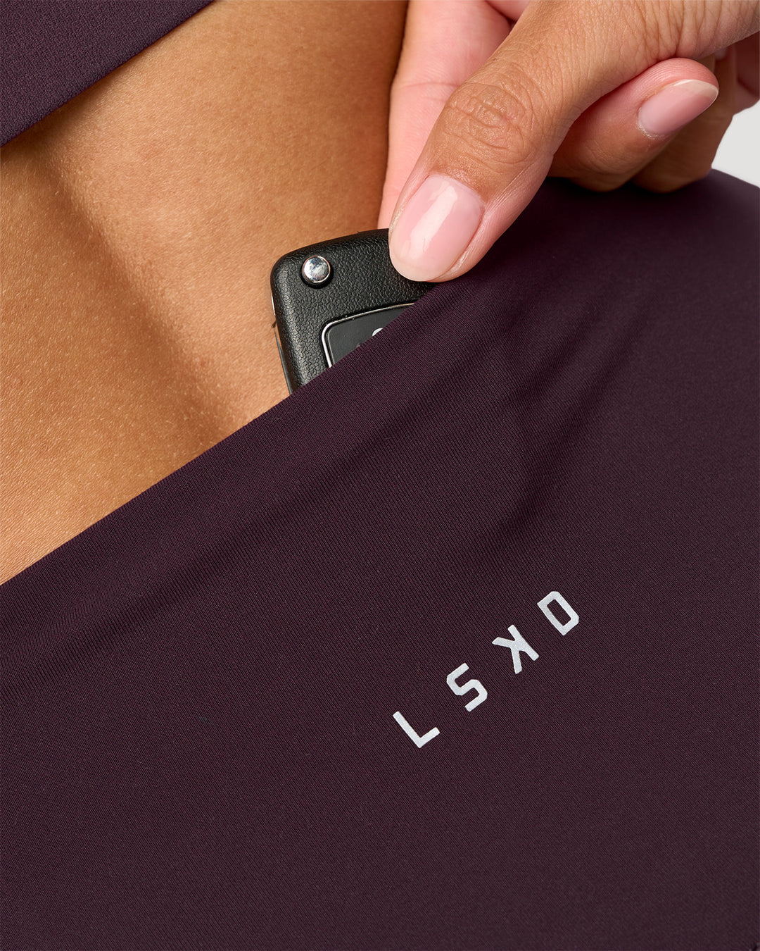 Woman wearing Fusion Ultra High-Rise 6" Short - Midnight Plum | Model:Rhiley | Size:S