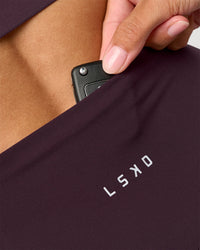 Woman wearing Fusion Ultra High-Rise 6" Short - Midnight Plum | Model:Rhiley | Size:S