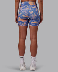 Woman wearing Fusion Ultra High-Rise 6" Short Pockets - Apricot Mist | Set:true | Angle:back | Model:Charlize | Size:S