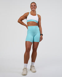 Woman wearing Fusion Ultra High-Rise 6" Short Pockets - Baltic Sea | Model:Sav | Size:S